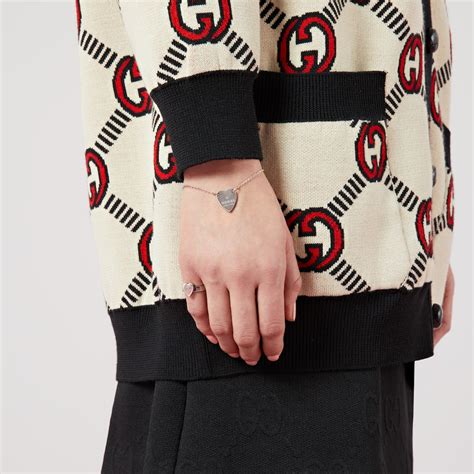 gucci heart shirt|Gucci heart bracelet with trademark.